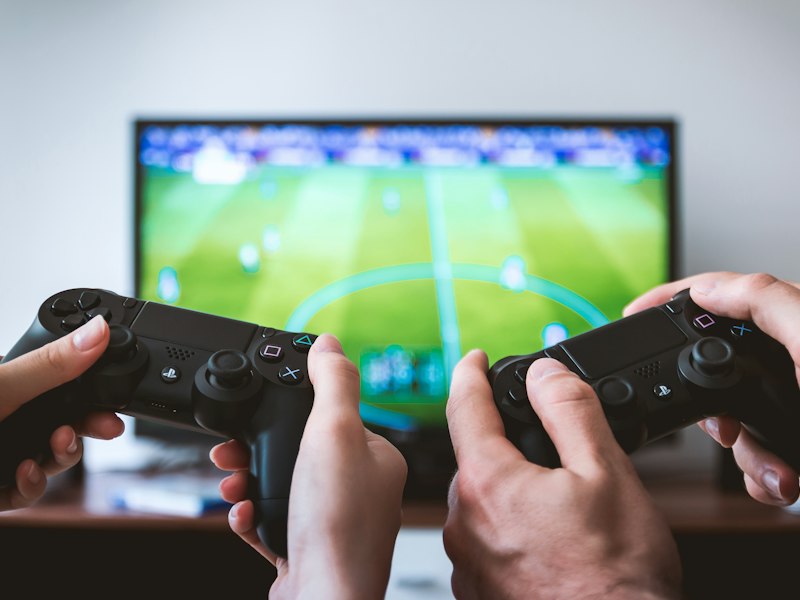 Coach reviewing gameplay footage with a player